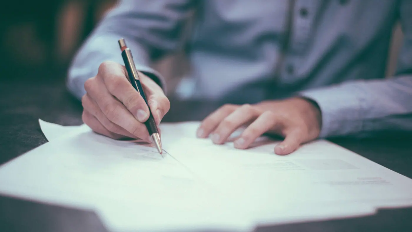 Government tender documentation and procurement paperwork on a desk