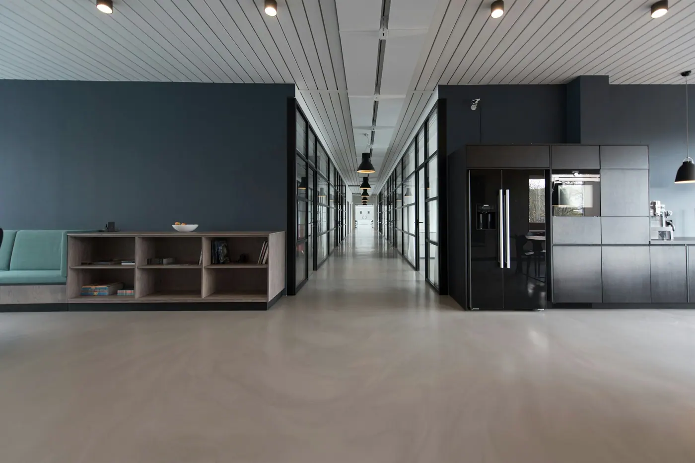 Modern open-plan business office with staff working at desktop workstations