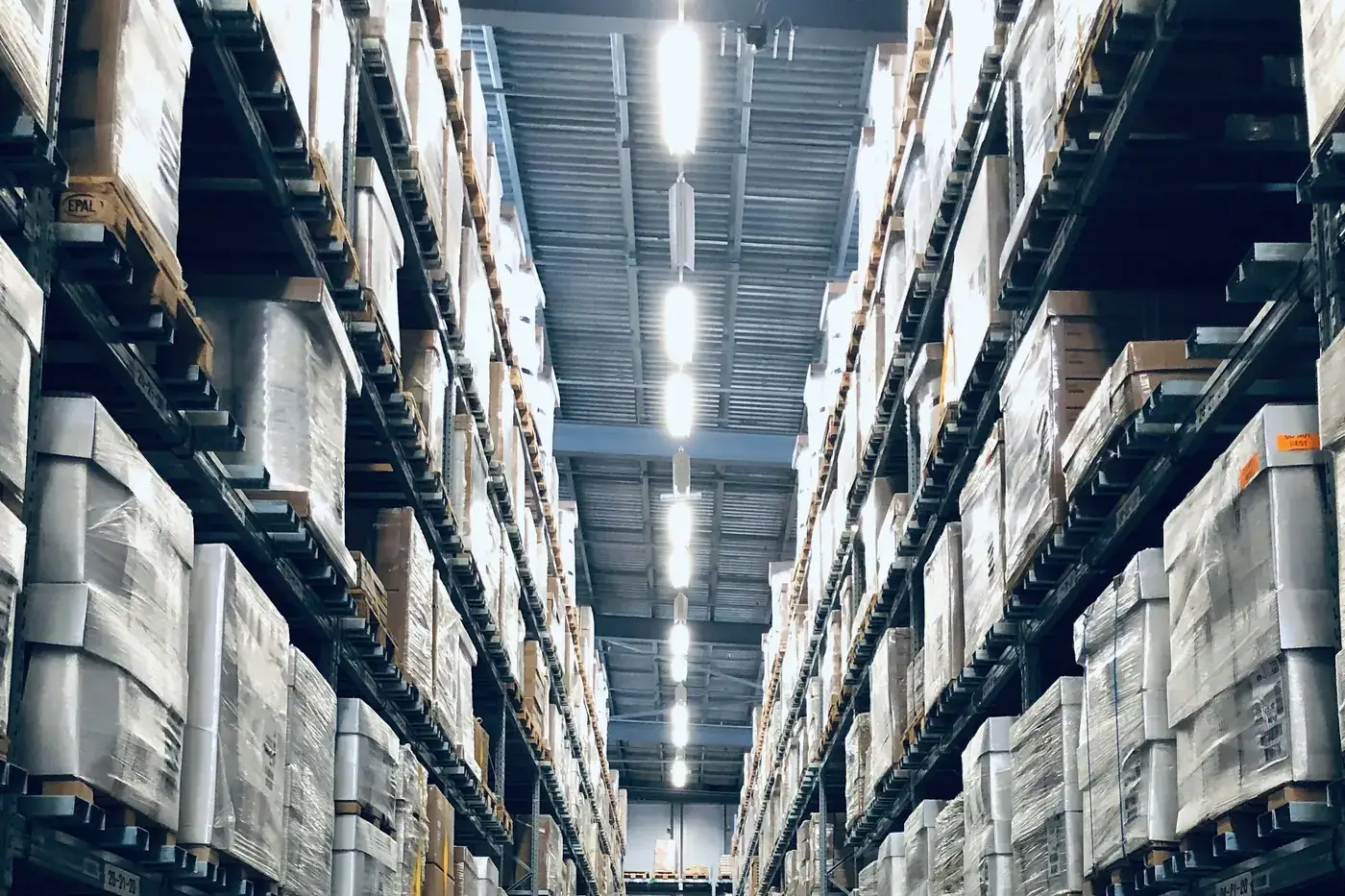 Consolidated pallets of boxed IT equipment prepared for institutional delivery