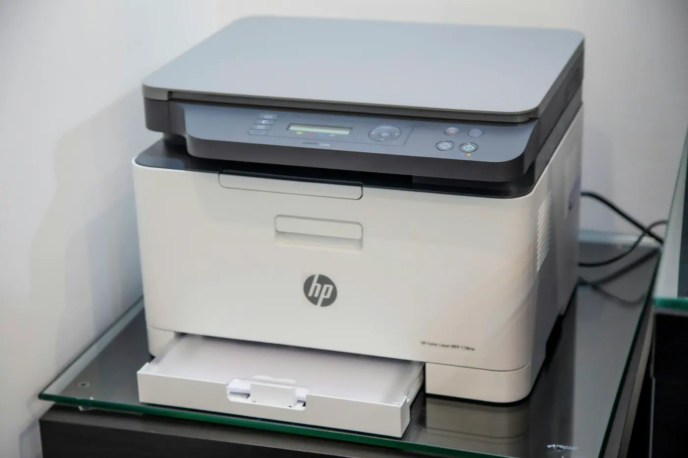 Multifunction office printer and document scanner in a workplace print area